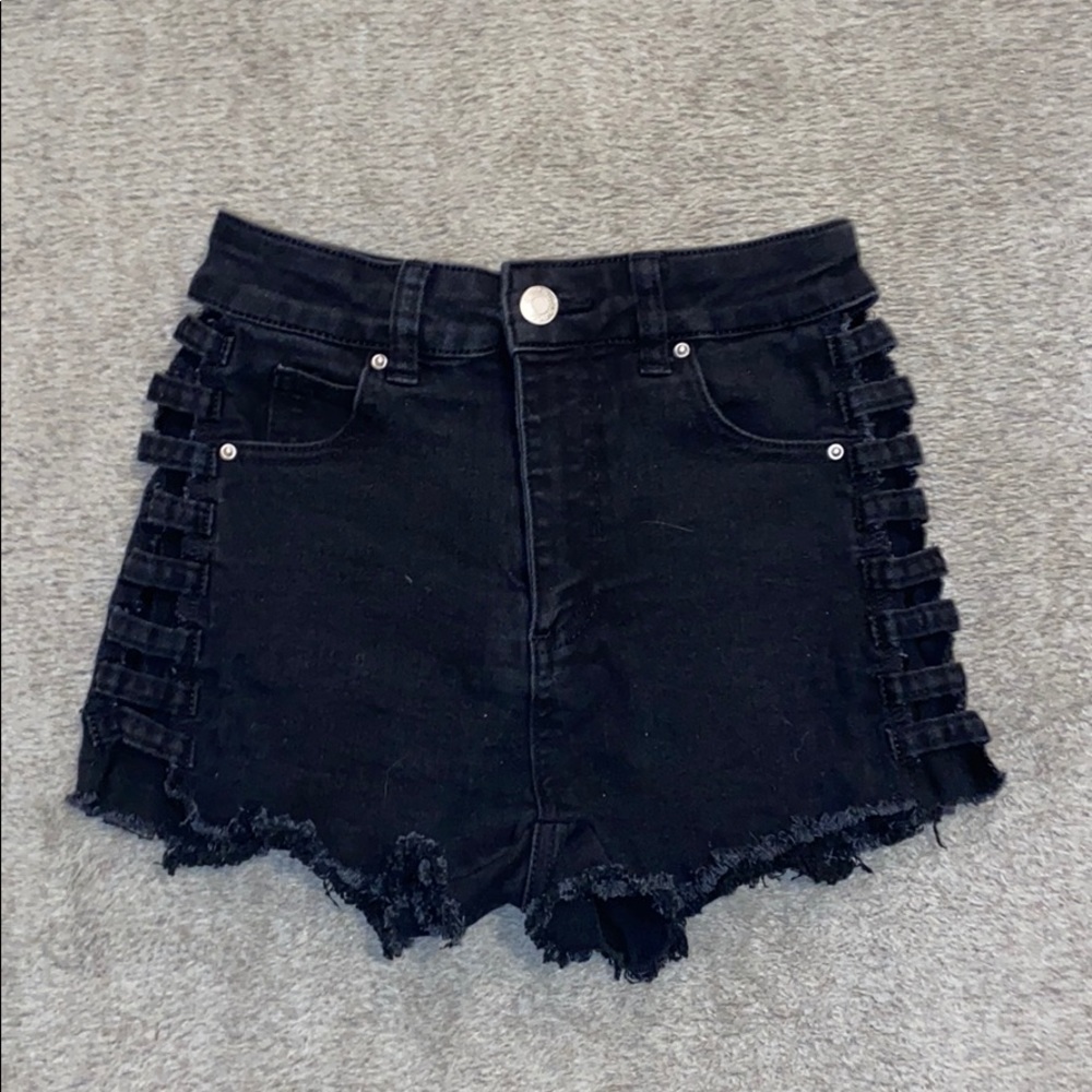 Black jean shorts from Litz with cut sides.